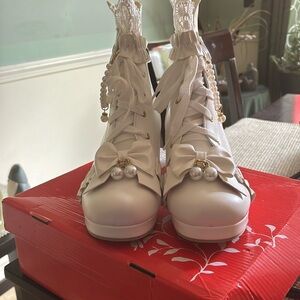 Winter white lace up boots.